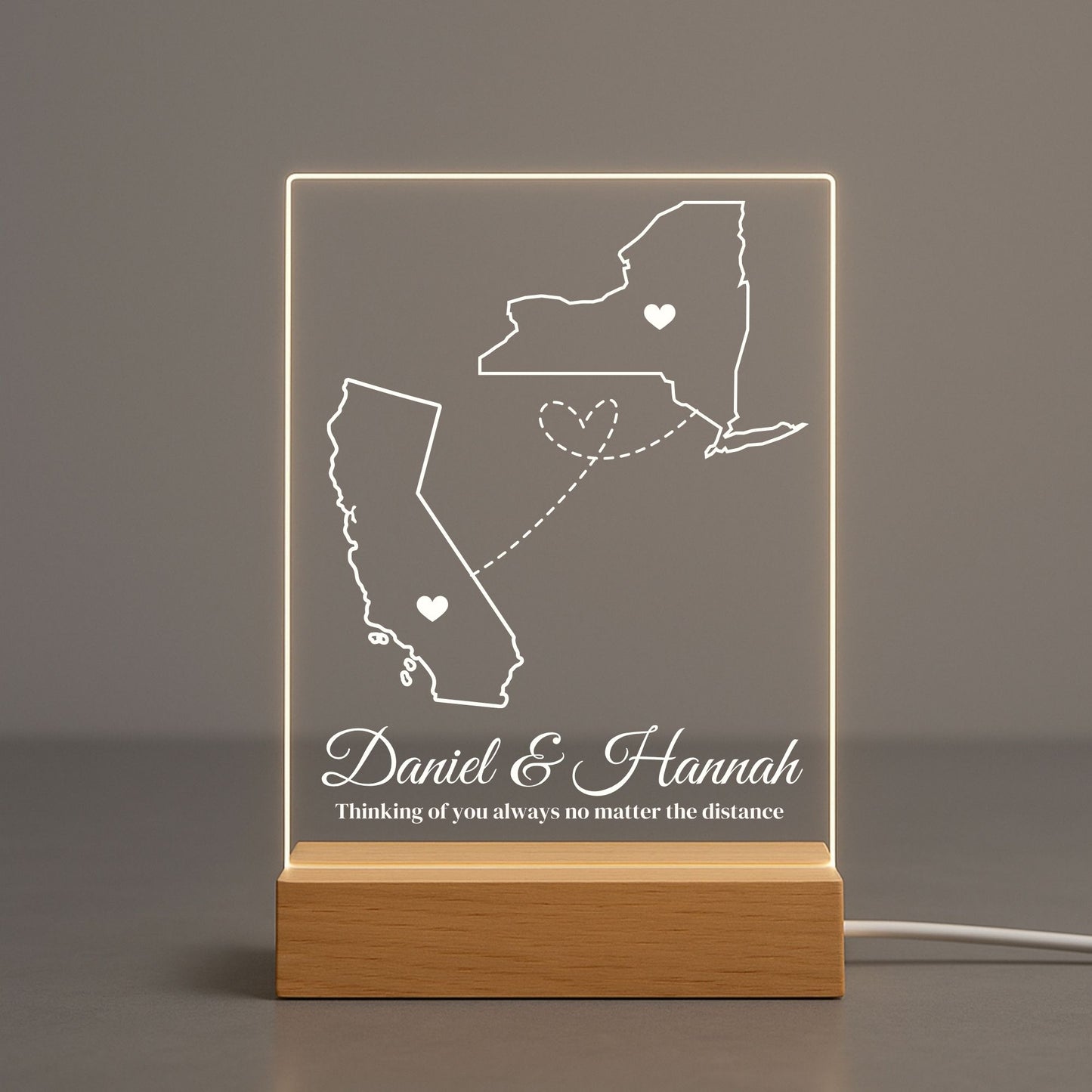 Modern acrylic lamp featuring a split-screen design of two different geographical regions
