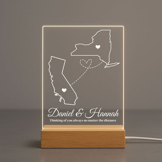 Modern acrylic lamp featuring a split-screen design of two different geographical regions