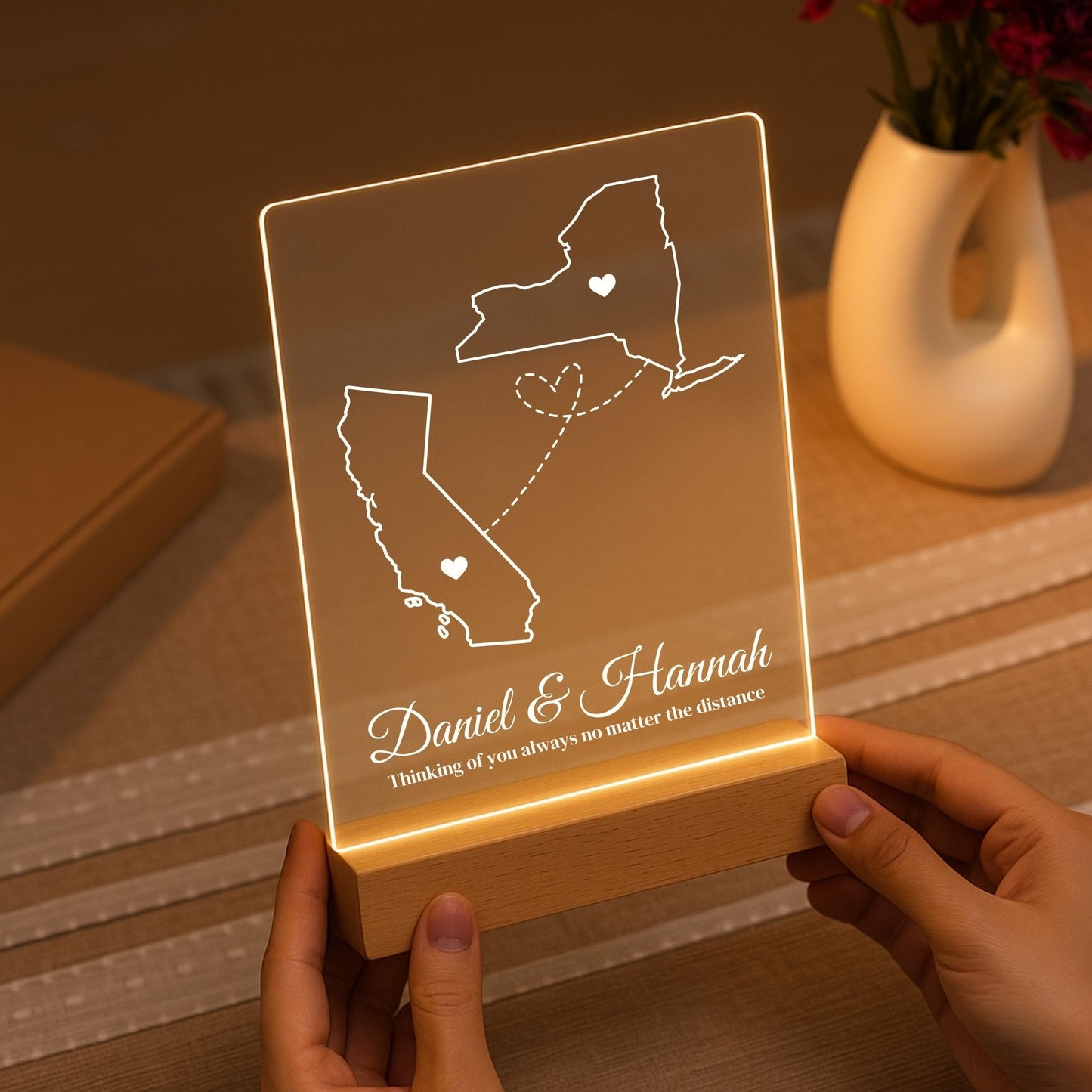 The warm LED light illuminating the etched borders of two different states.