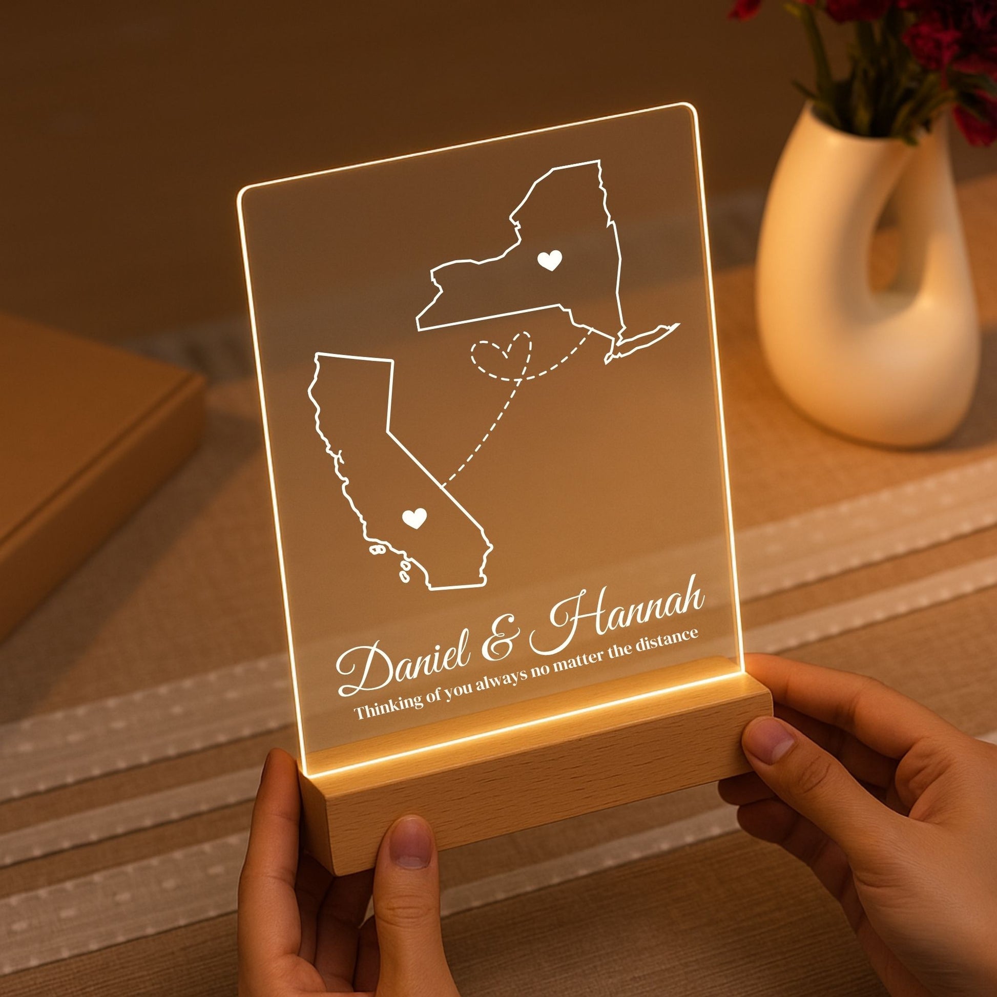The warm LED light illuminating the etched borders of two different states.