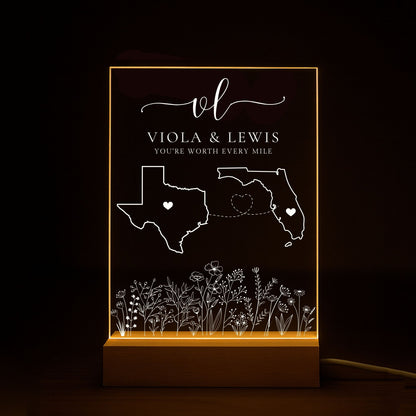 Custom long-distance acrylic plaque with a heart icon centered in two different states.