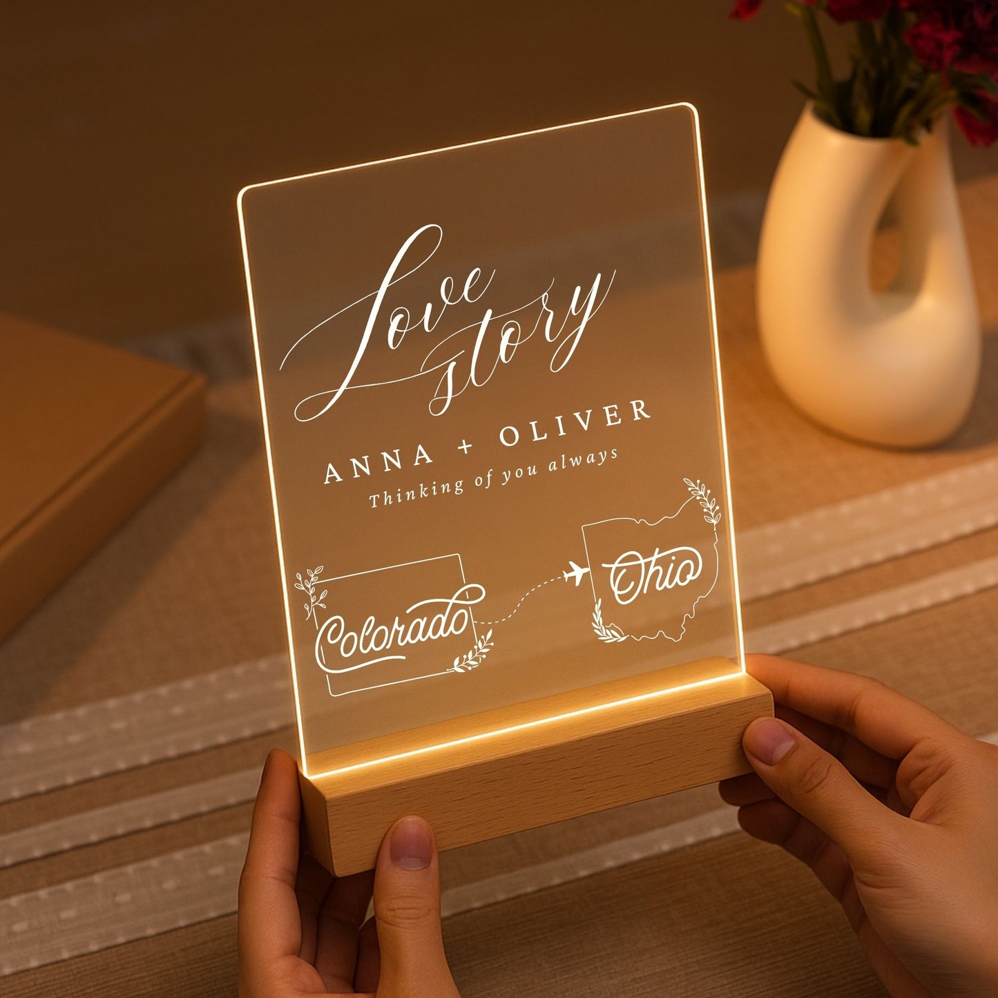 Minimalist wooden LED base holding a glowing acrylic sheet with custom state maps.