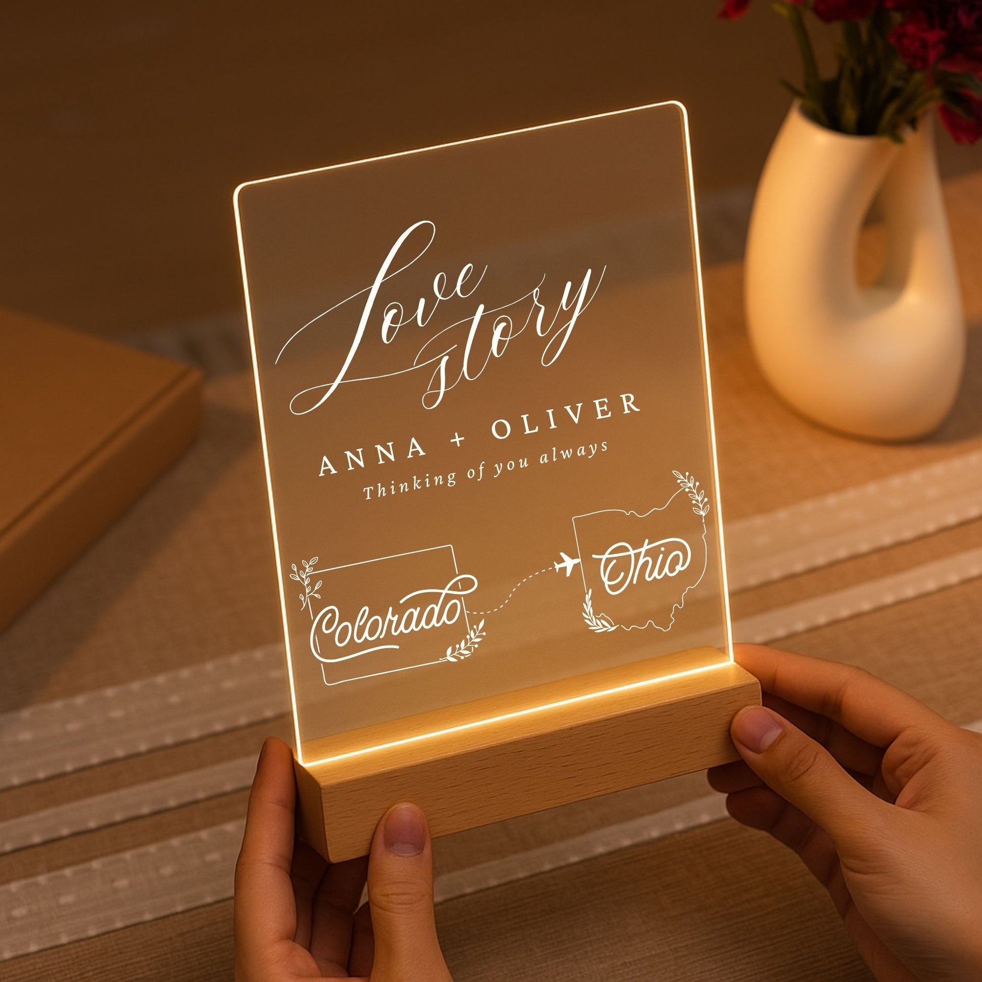 Minimalist wooden LED base holding a glowing acrylic sheet with custom state maps.