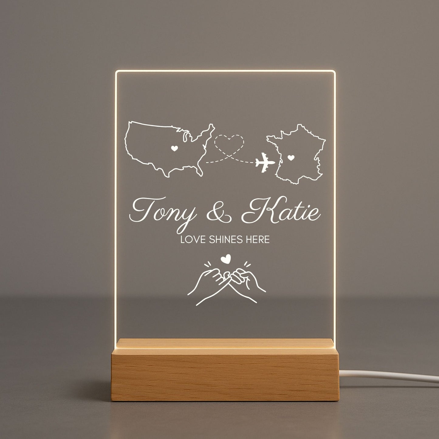 Detailed view of the dotted heart path connecting two states on a clear night light.
