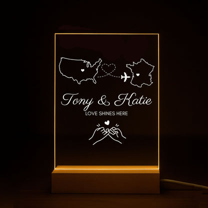 Meaningful long-distance relationship gift: an acrylic lamp connecting two home states.
