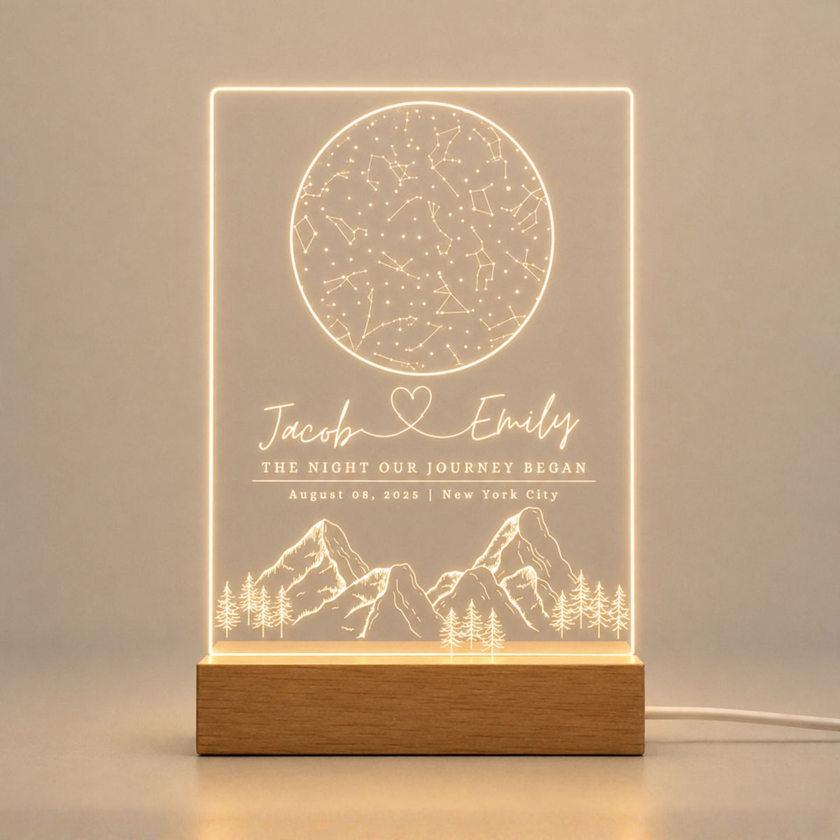Studio front view of illuminated round constellation star map acrylic lamp glowing warm white on a natural wooden LED stand.