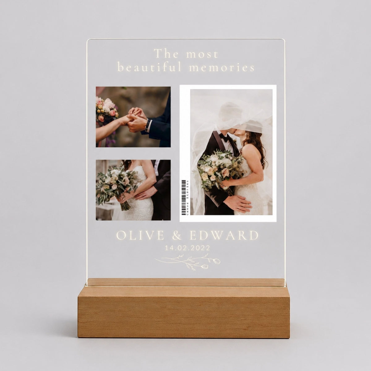 Studio front view of unlit clear acrylic plaque featuring 3-photo wedding collage, header message, couple names, and date on a beech wood base.