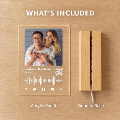 Product packaging breakdown showing the custom QR code music acrylic panel alongside the solid wooden LED strip base.
