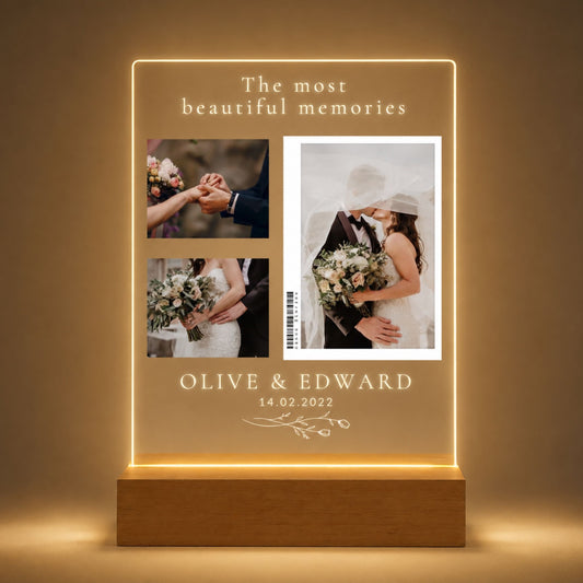 Studio front view of illuminated three-picture wedding collage acrylic night light glowing warm white on a natural wooden LED stand.