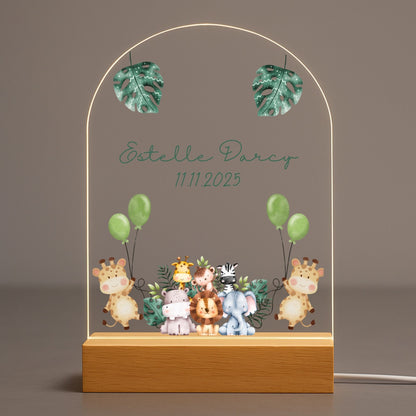 Personalized animal baby night light featuring a watercolor lion illustration on an acrylic plate with solid wood base.