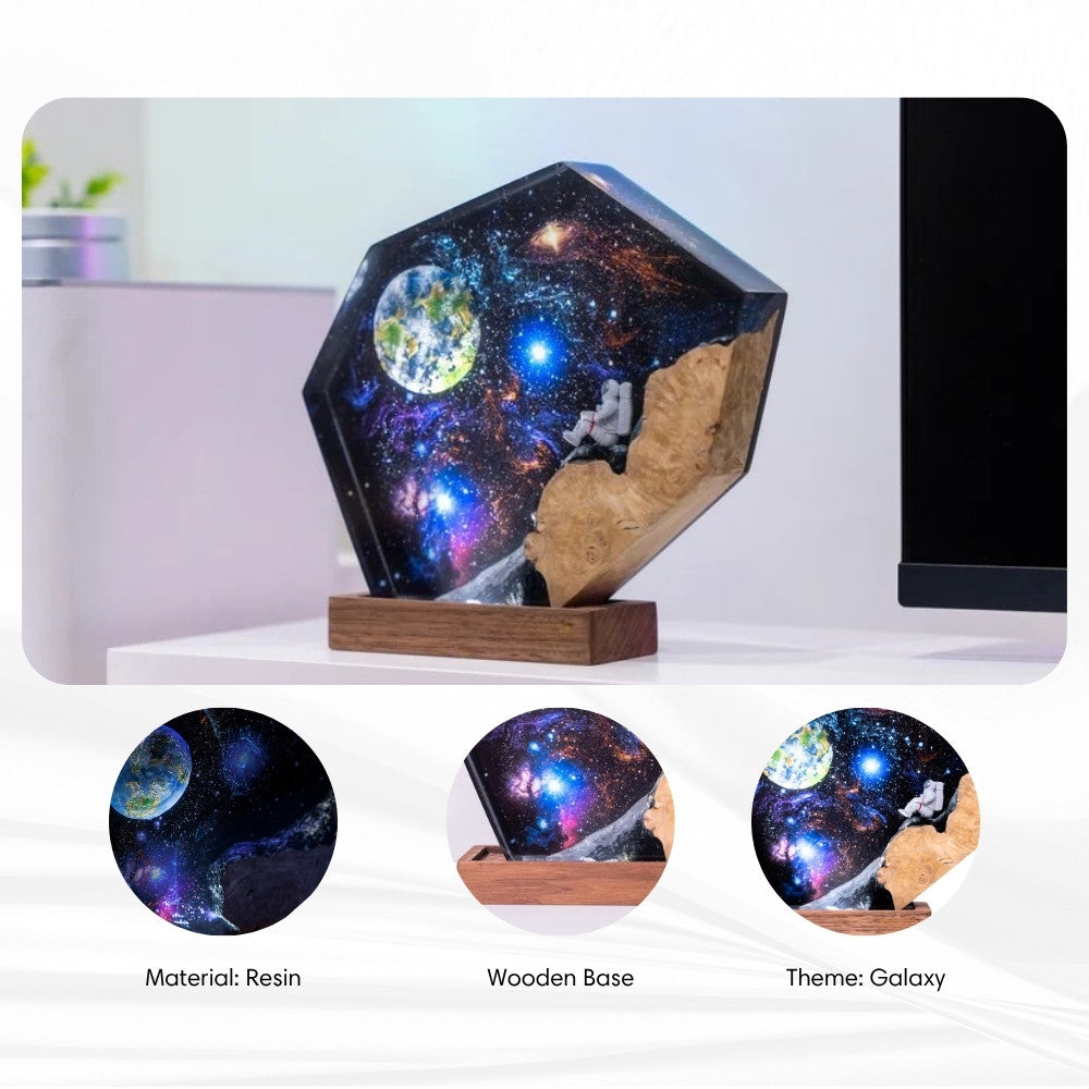 Detailed view of the 3D internal laser etching showing different galaxy and constellation designs.