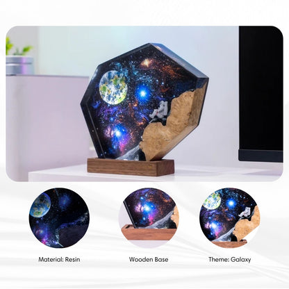 Detailed view of the 3D internal laser etching showing different galaxy and constellation designs.