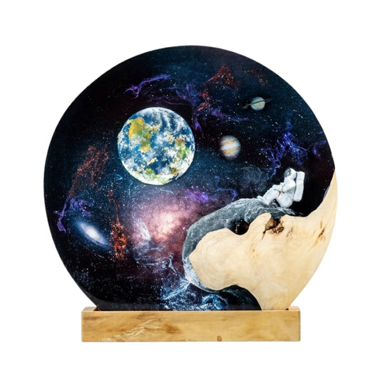 Handmade resin lamp with astronaut design on a white background