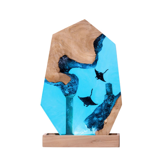 Handmade pentagon epoxy resin lamp with manta rays and sunken column ruins on light burl wood base — bright turquoise ocean decor gift