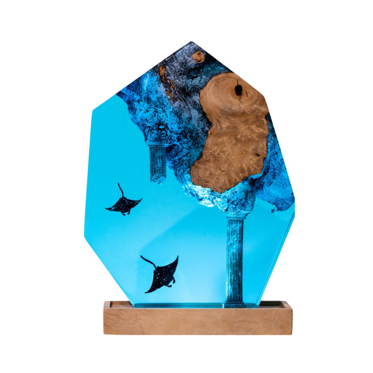 Handmade hexagon epoxy resin lamp with two manta rays, sunken column, and embedded burl wood knot — vivid turquoise ocean decor gift