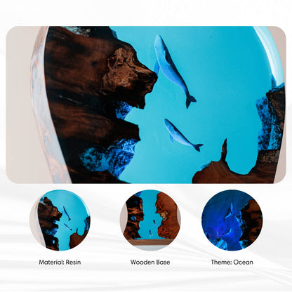Close-up of the handmade whale resin LED headphone stand showing ocean artwork and wooden base features