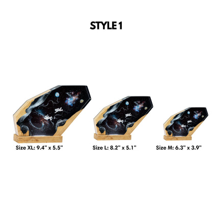 Size chart for astronaut galaxy epoxy resin lamp showcasing three available dimensions: Medium (6.3 by 3.9 inches), Large (8.2 by 5.1 inches), and Extra Large (9.4 by 5.5 inches)