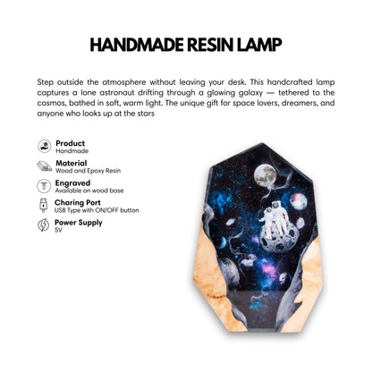 A handmade epoxy lamp showcasing a space-themed design with two astronauts sitting on a small moon