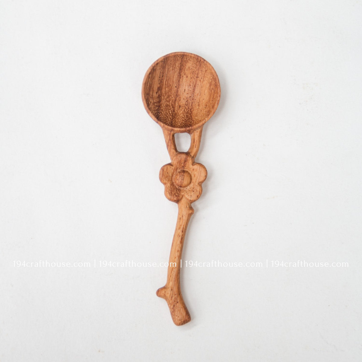 Flower handle Doussie wood spice spoon on a white background, showing the full handcrafted mini scoop and floral detail.
